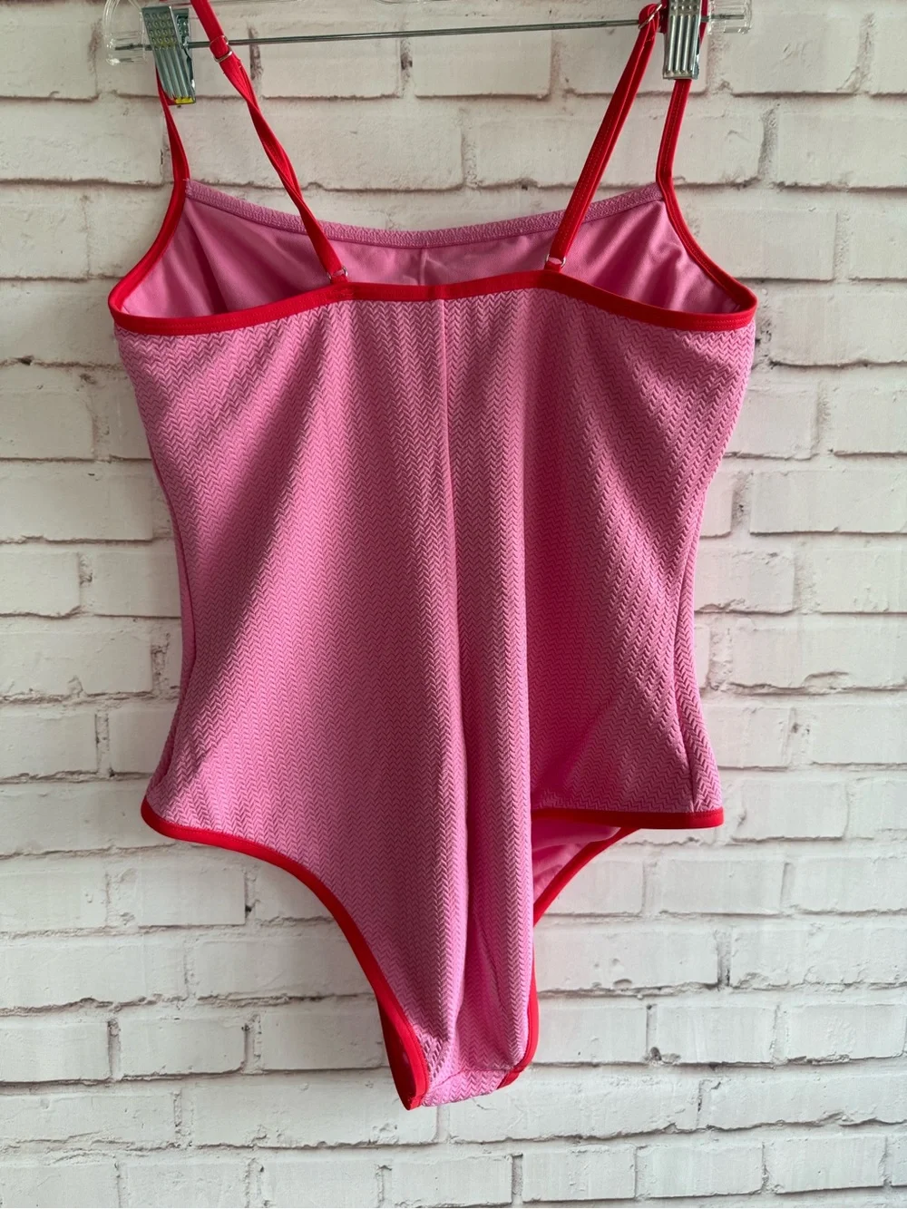 Pink One-Piece Swimsuit with Red Trim